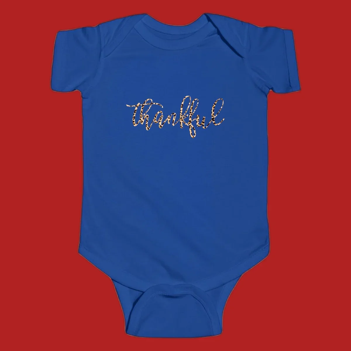 Thankful text in leopard print with a white outline.