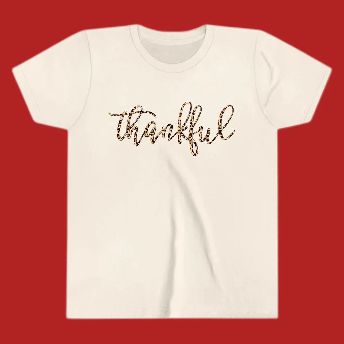 Thankful text in leopard print with a white outline.