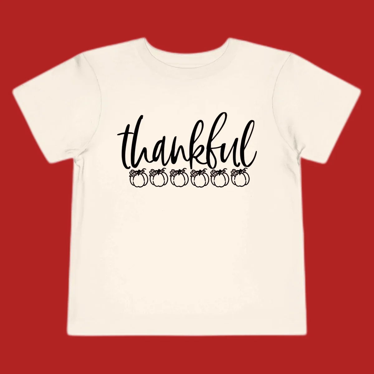 White script text 'thankful' above six white pumpkin illustrations, thankful pumpkins thanksgiving