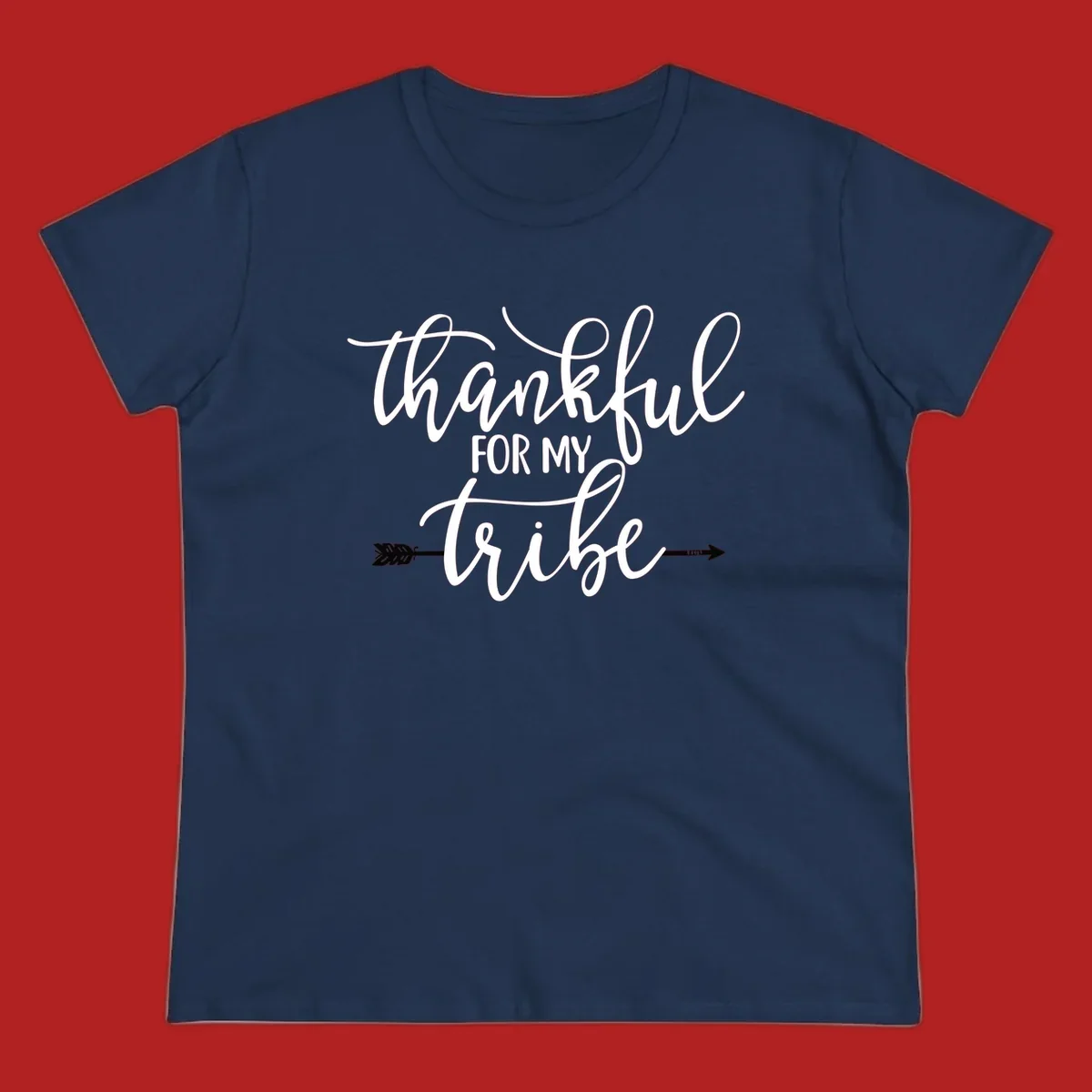 Thankful for my tribe typography design with arrow graphic on black background.