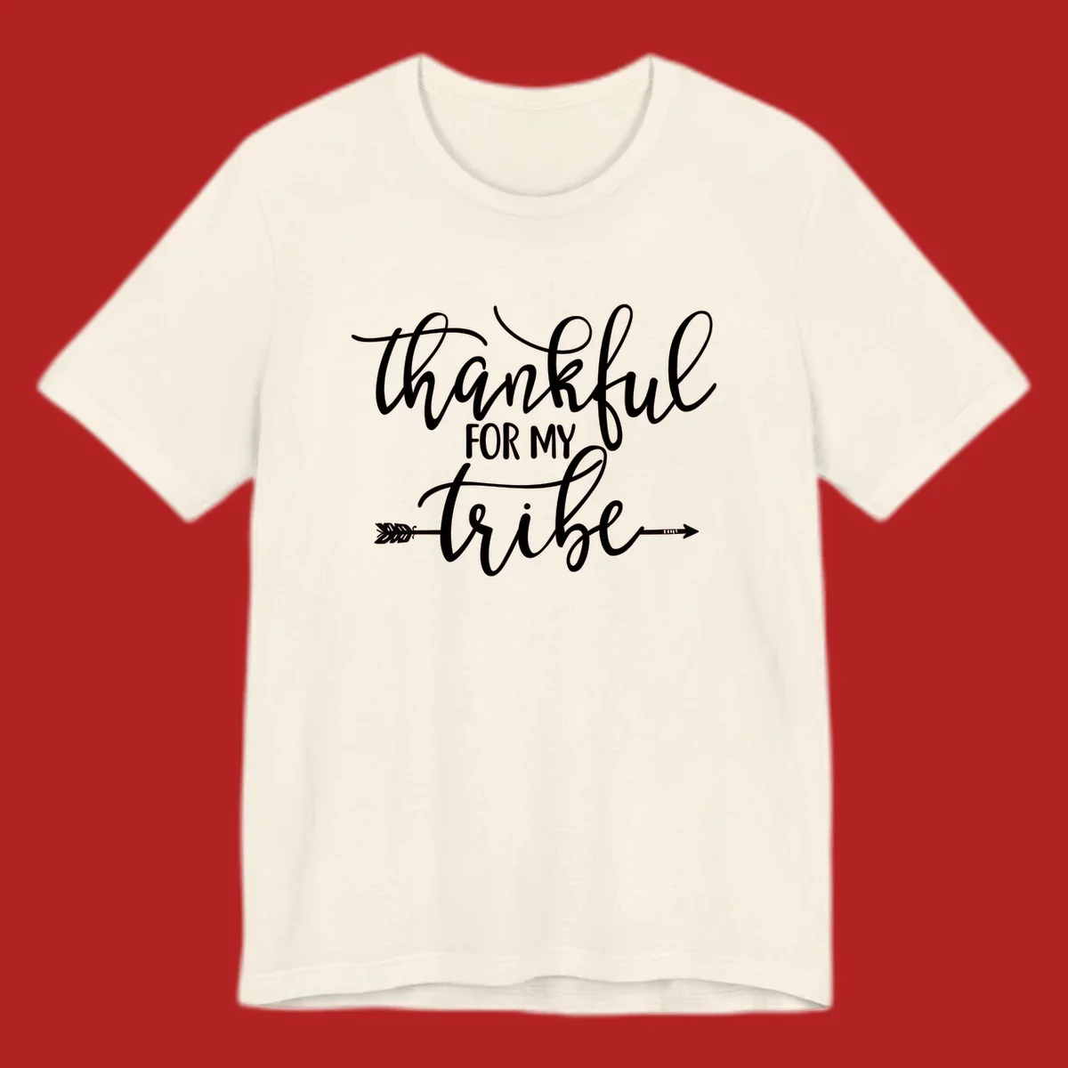 Thankful for my tribe typography design with arrow graphic on black background.