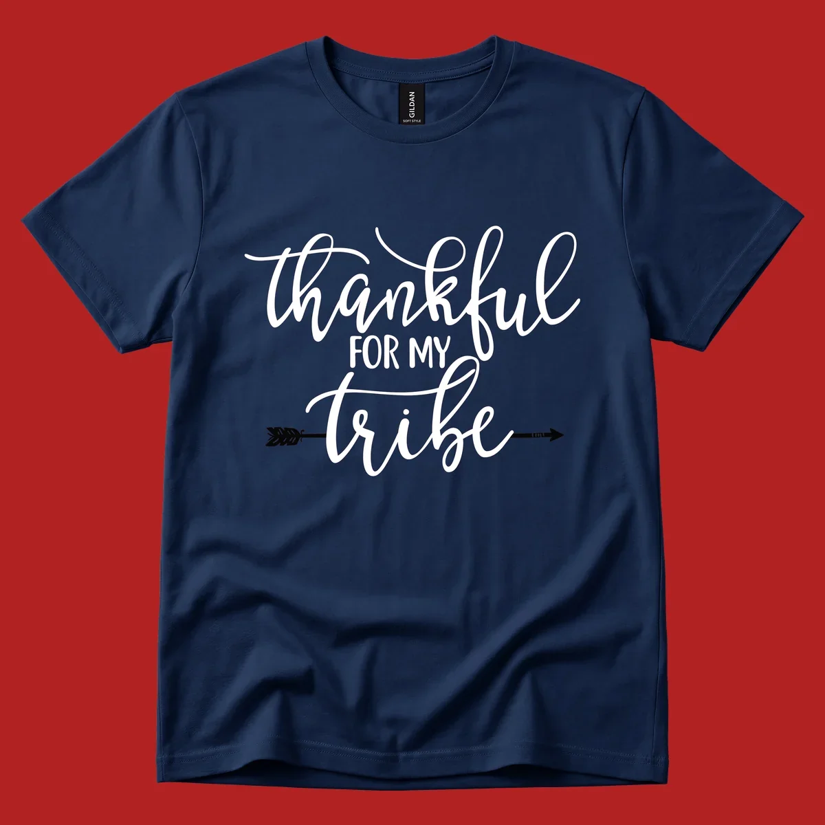 Thankful for my tribe typography design with arrow graphic on black background.