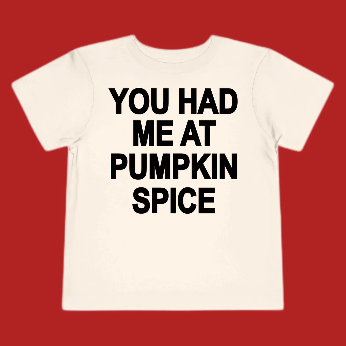 White typography design that says "YOU HAD ME AT PUMPKIN SPICE" for pumpkin spice lovers.