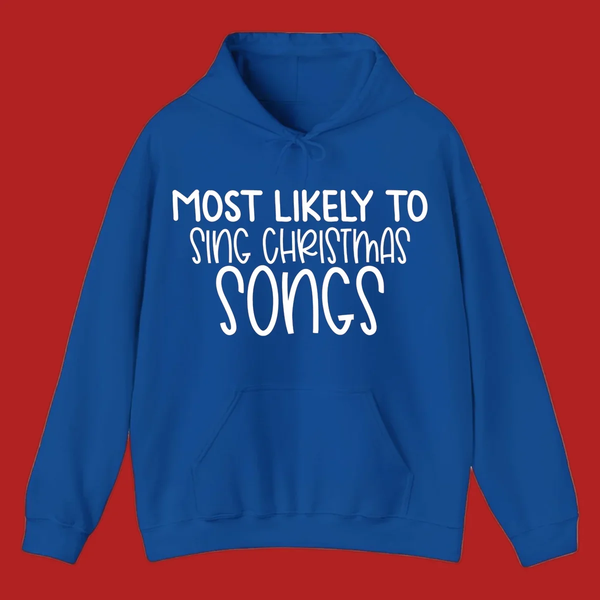 Text design 'Most Likely To Sing Christmas Songs' in white, bold lettering.