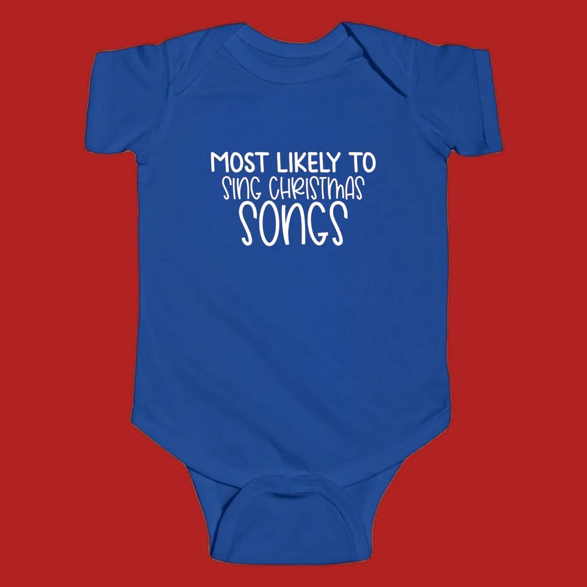 Text design 'Most Likely To Sing Christmas Songs' in white, bold lettering.