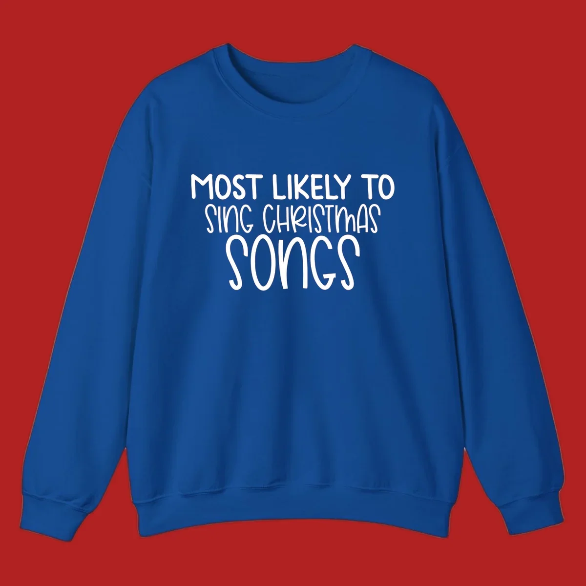 Text design 'Most Likely To Sing Christmas Songs' in white, bold lettering.