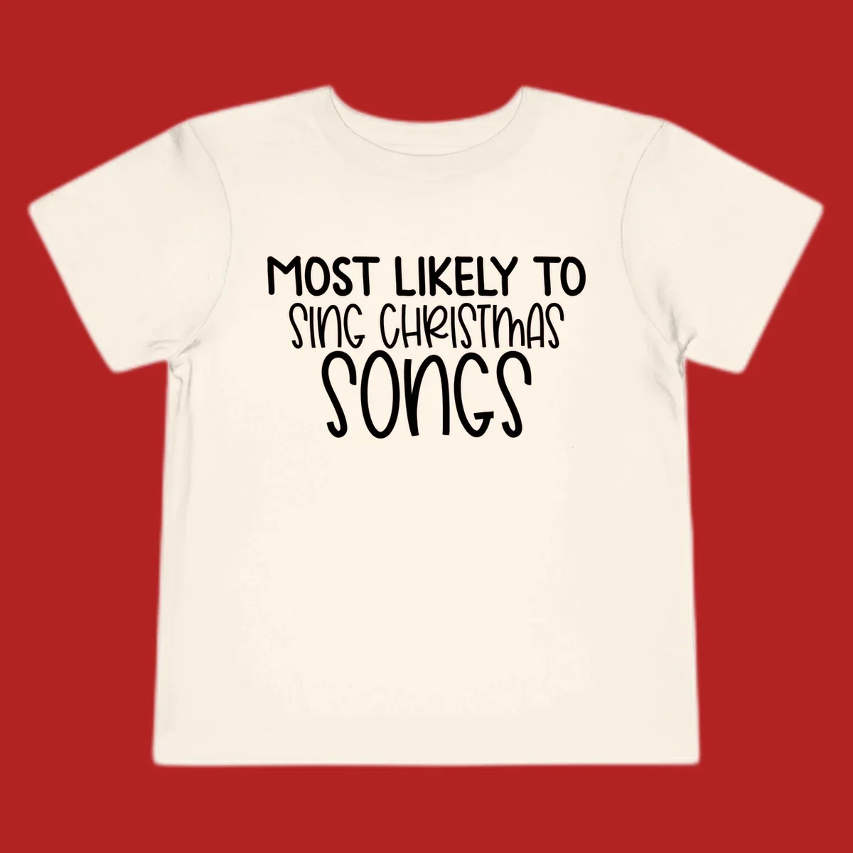 Text design 'Most Likely To Sing Christmas Songs' in white, bold lettering.