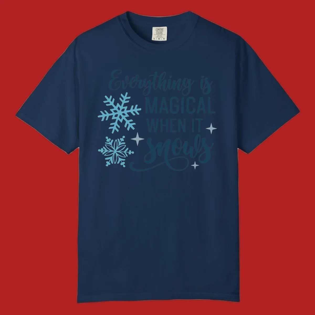 Everything is Magical When It Snows typography with snowflakes and stars.