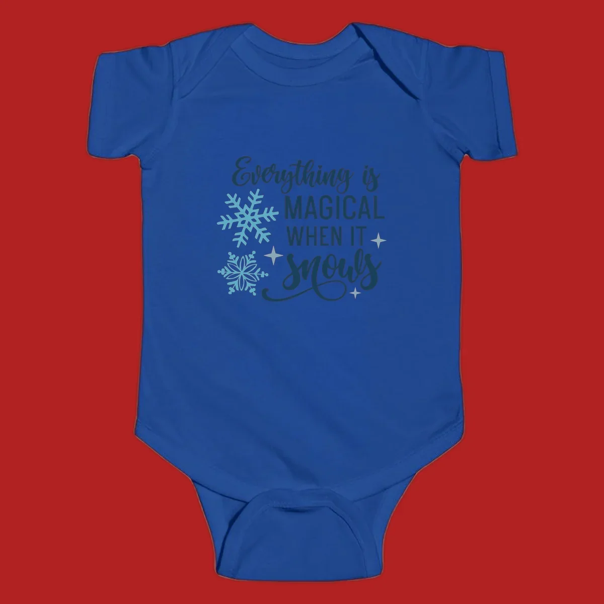 Everything is Magical When It Snows typography with snowflakes and stars.