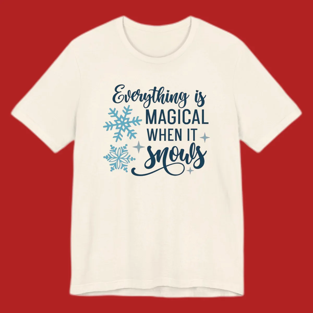 Everything is Magical When It Snows typography with snowflakes and stars.