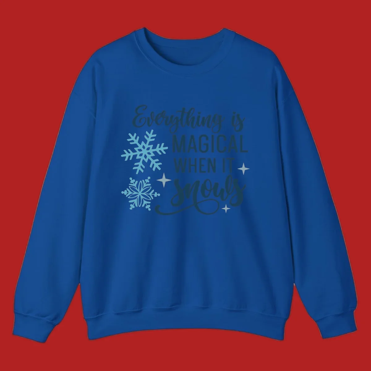 Everything is Magical When It Snows typography with snowflakes and stars.