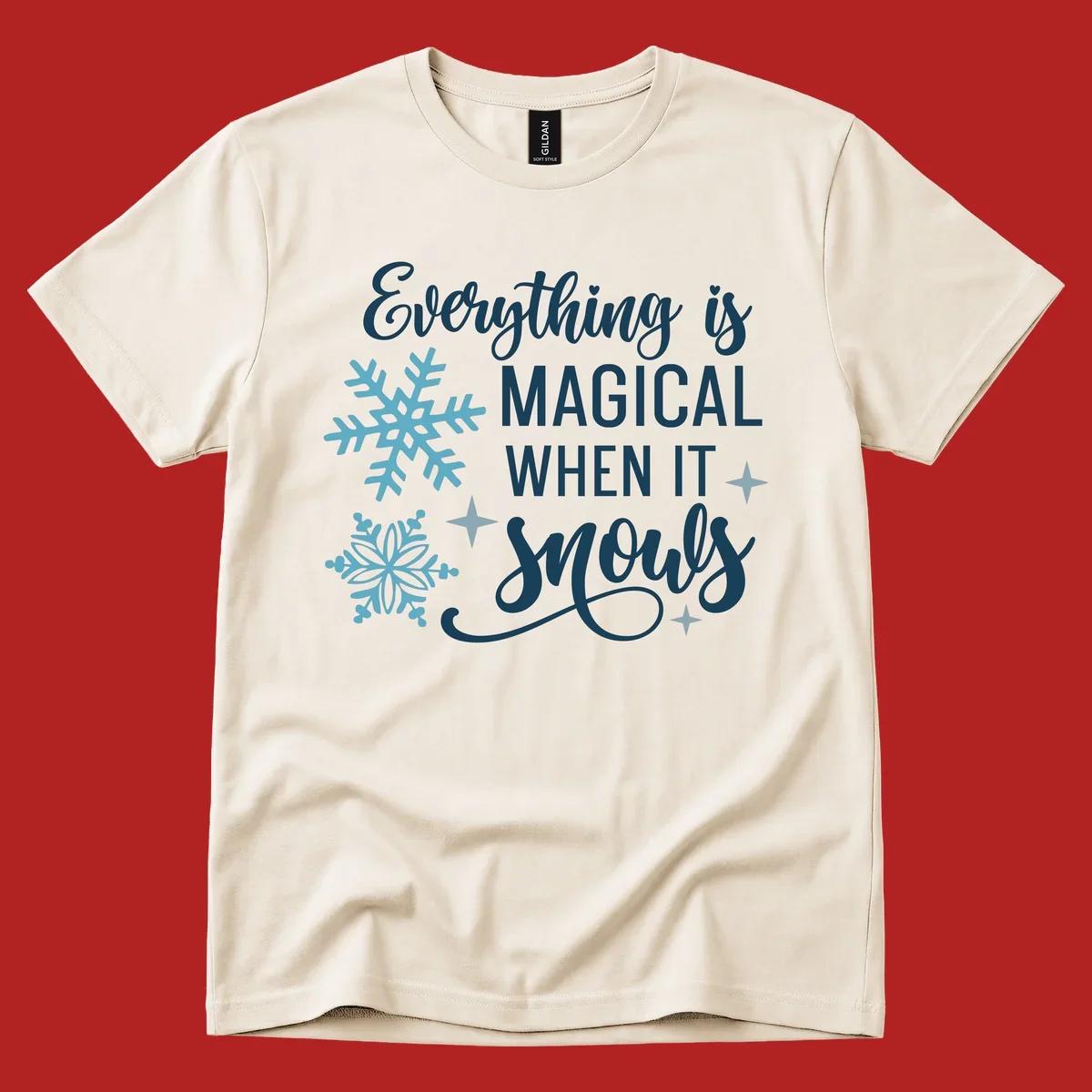 Everything is Magical When It Snows typography with snowflakes and stars.