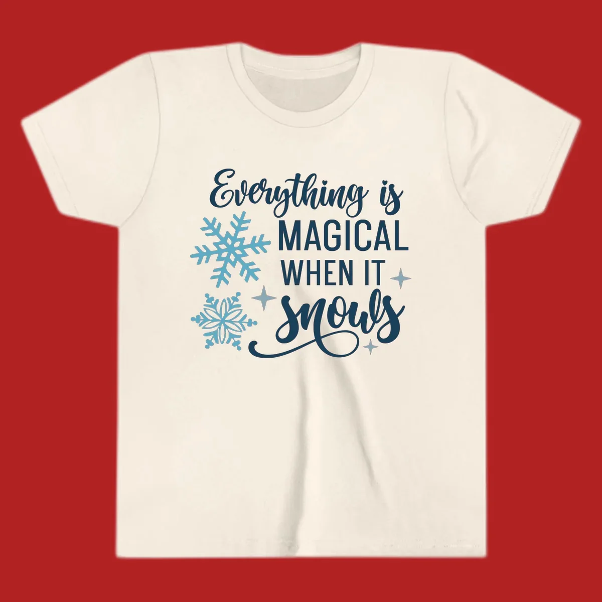 Everything is Magical When It Snows typography with snowflakes and stars.