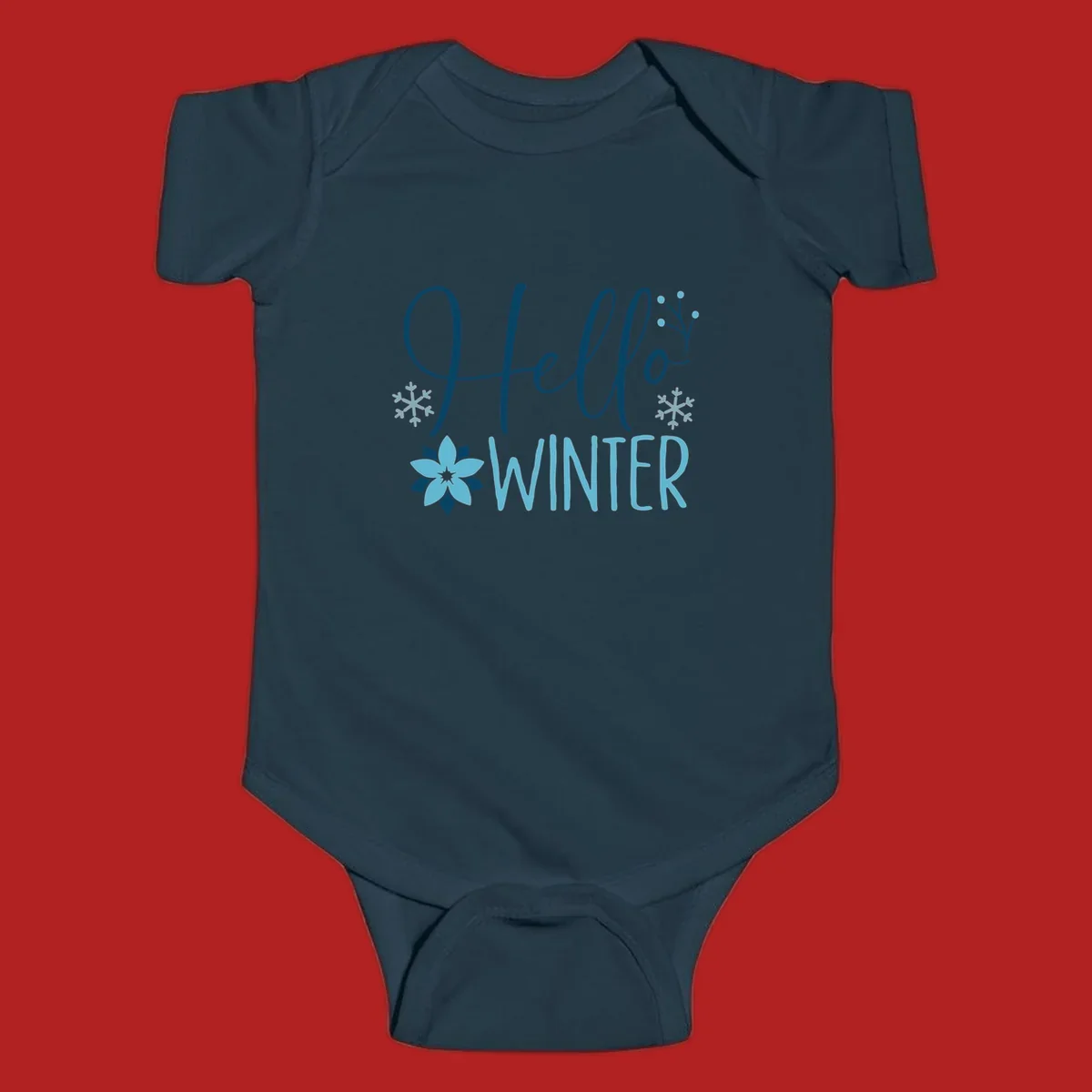 Hello Winter graphic with script text, snowflakes, and winter flower.