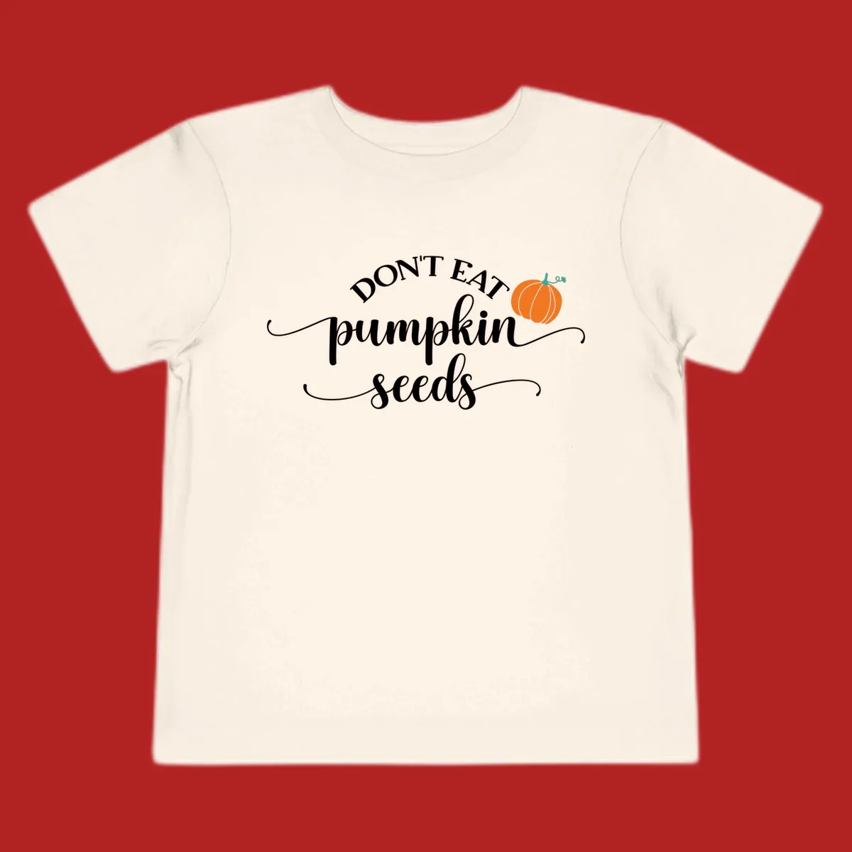 Don't Eat Pumpkin Seeds fall phrase with pumpkin illustration.