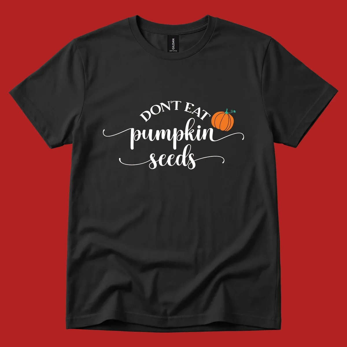 Don't Eat Pumpkin Seeds fall phrase with pumpkin illustration.