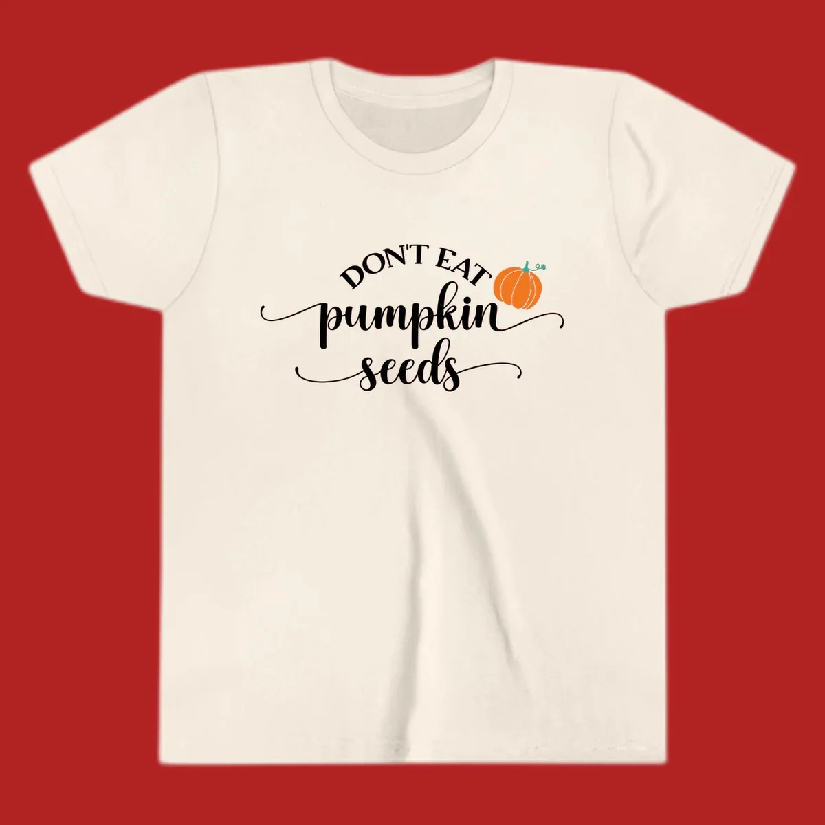 Don't Eat Pumpkin Seeds fall phrase with pumpkin illustration.
