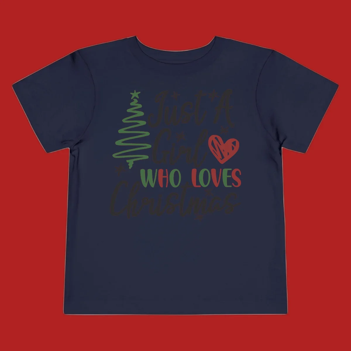 Girl who loves Christmas typography with tree and heart graphic.