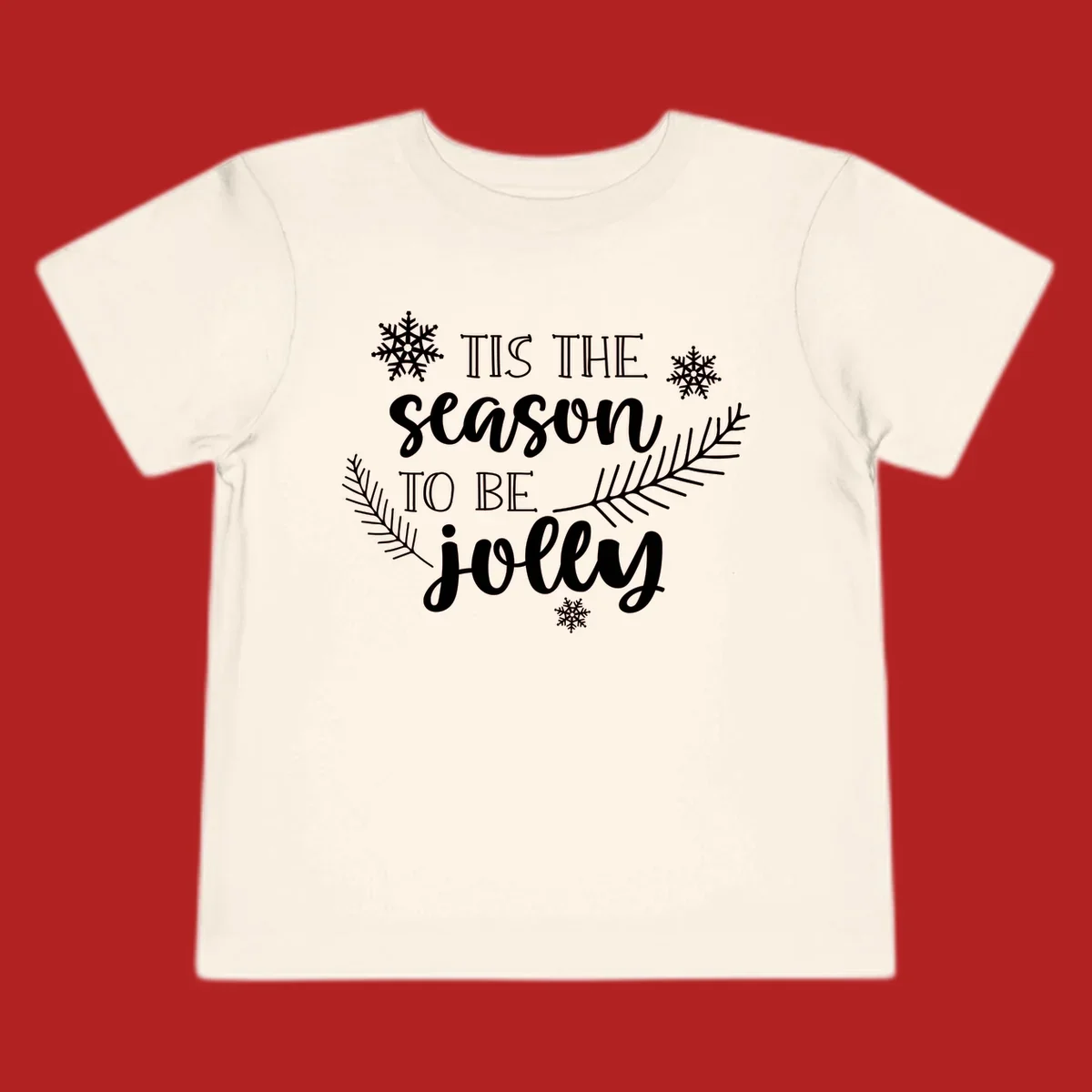 Tis the season to be jolly Christmas design with snowflakes and pine branches.