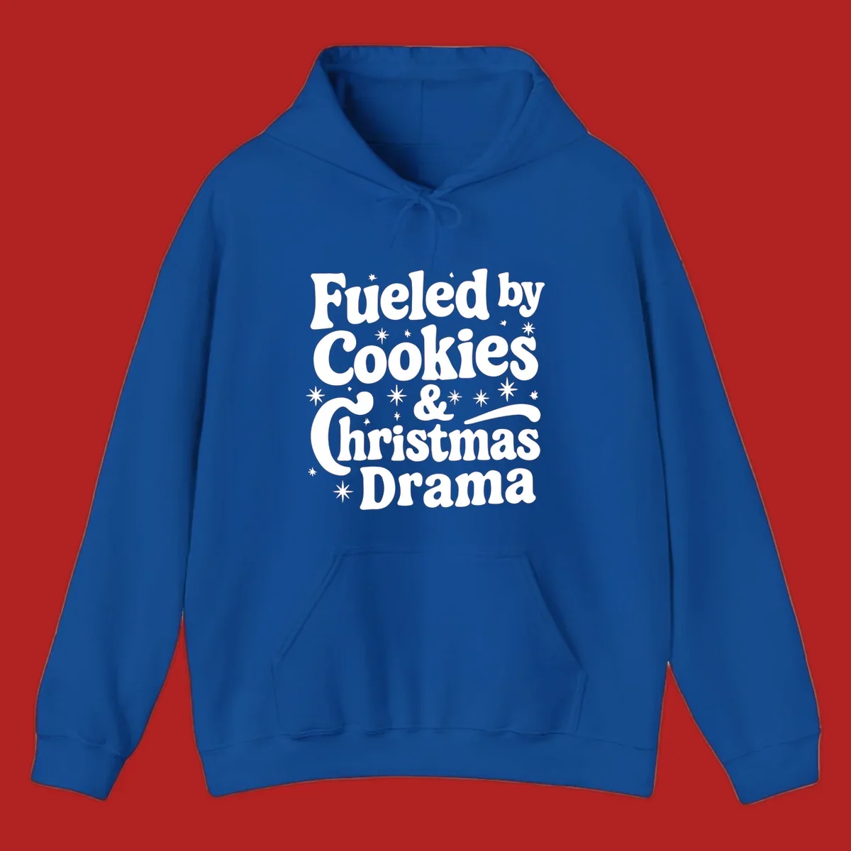 Text design 'Fueled by Cookies & Christmas Drama' with stars, for Christmas.