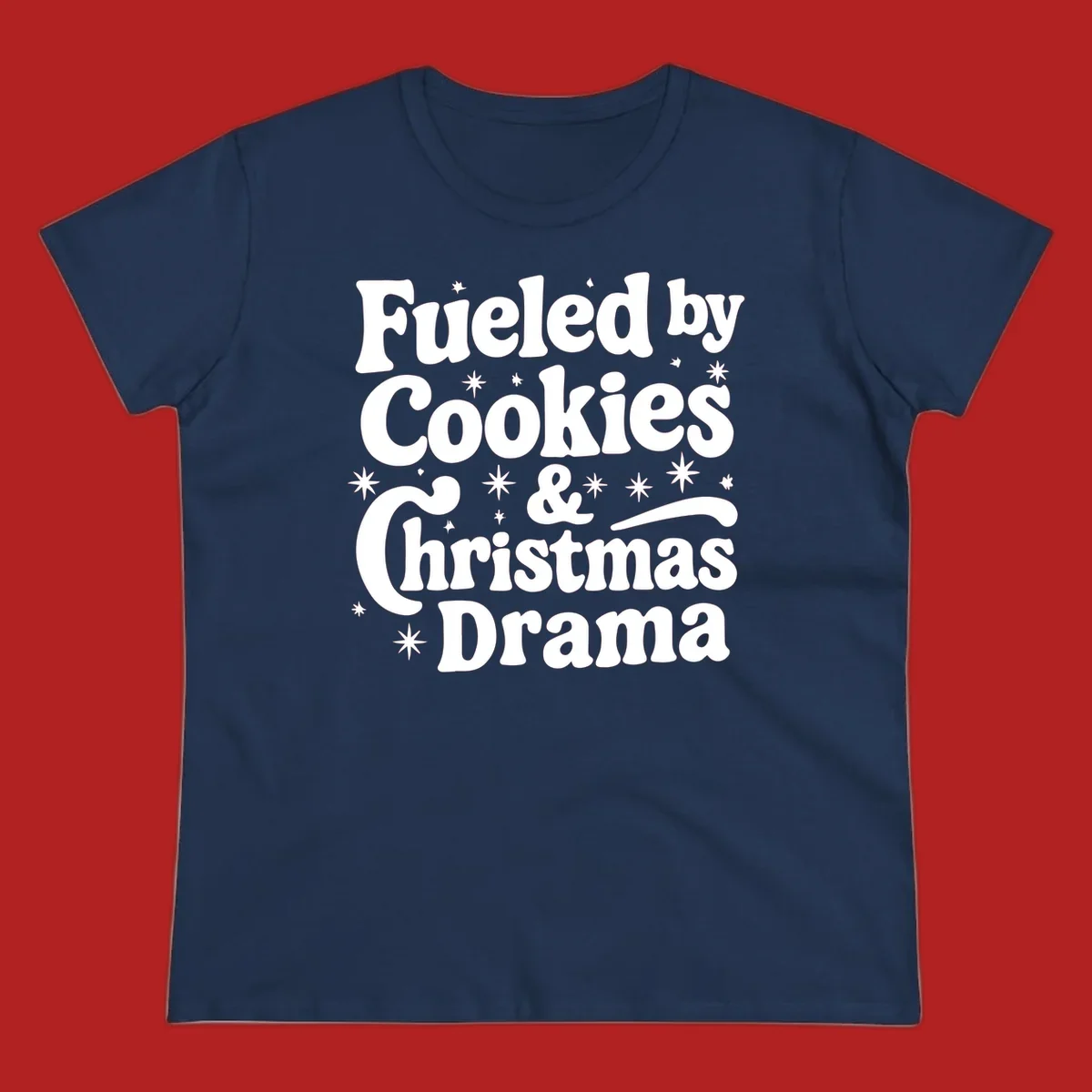 Text design 'Fueled by Cookies & Christmas Drama' with stars, for Christmas.