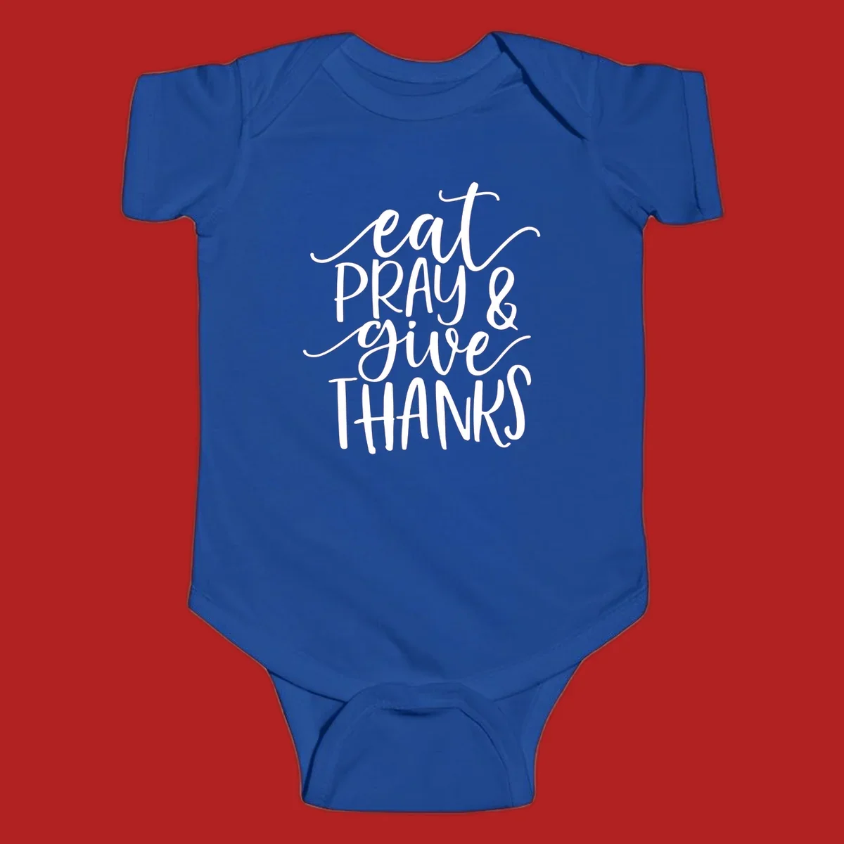 Eat Pray Give Thanks hand-lettered design with white text on a dark background.