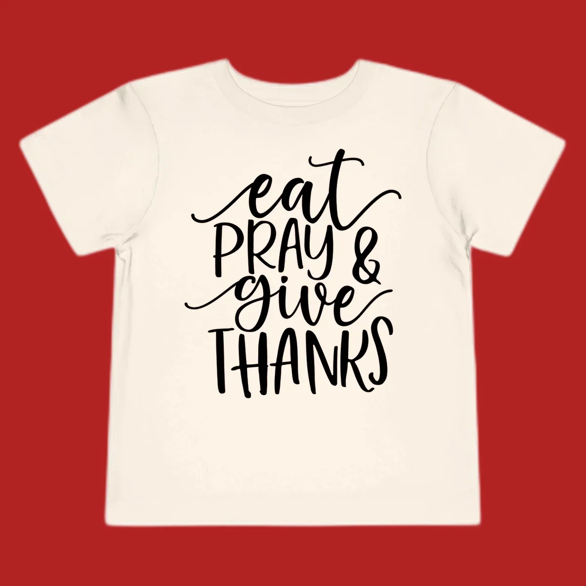 Eat Pray Give Thanks hand-lettered design with white text on a dark background.