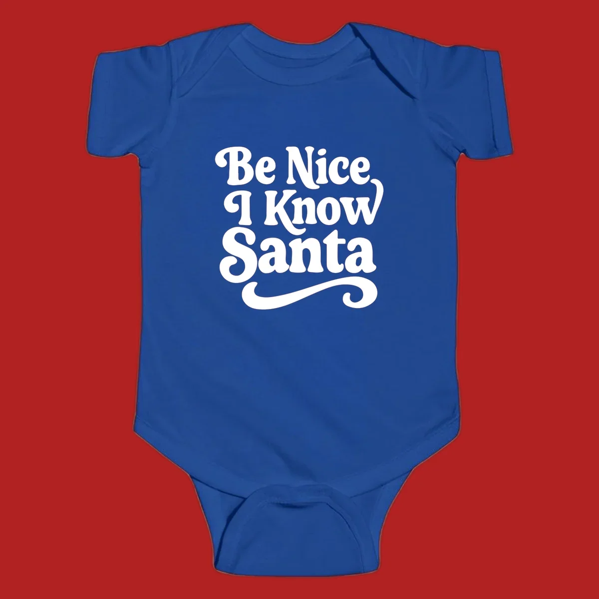 White retro text 'Be Nice I Know Santa' with a flourish, holiday design.