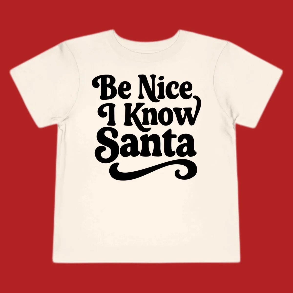 White retro text 'Be Nice I Know Santa' with a flourish, holiday design.