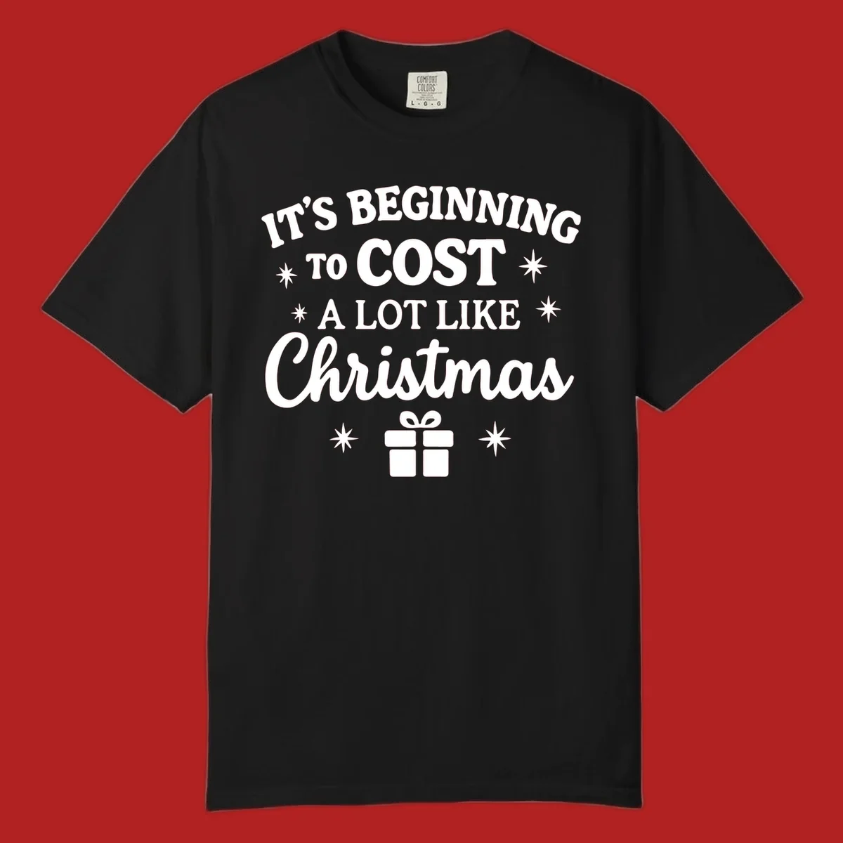 Typography design that says "It's Beginning To Cost A Lot Like Christmas" with stars and a gift box.