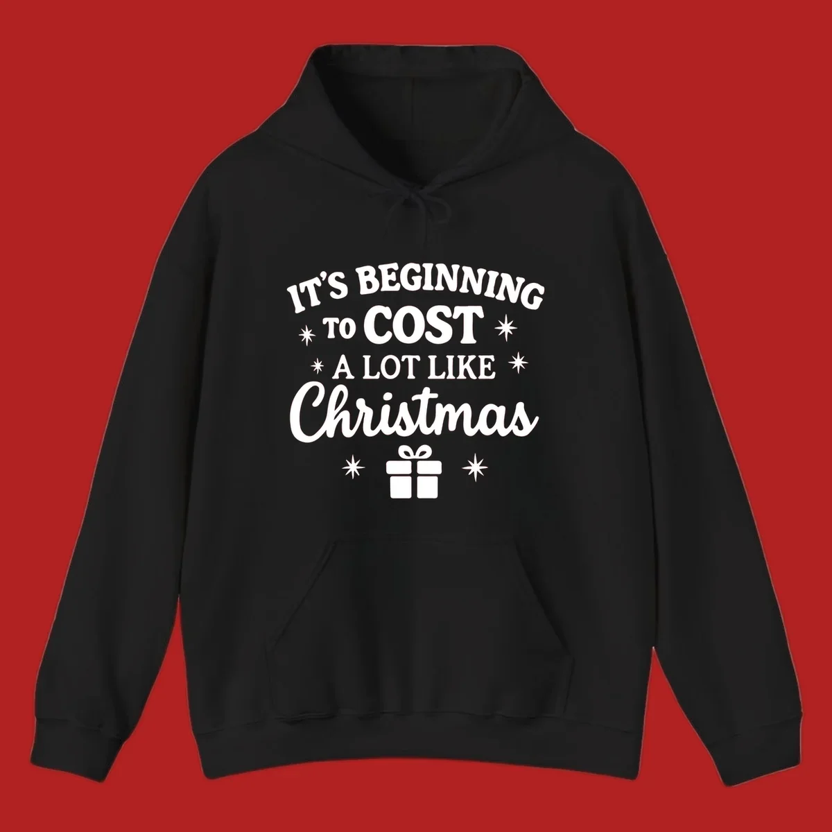 Typography design that says "It's Beginning To Cost A Lot Like Christmas" with stars and a gift box.