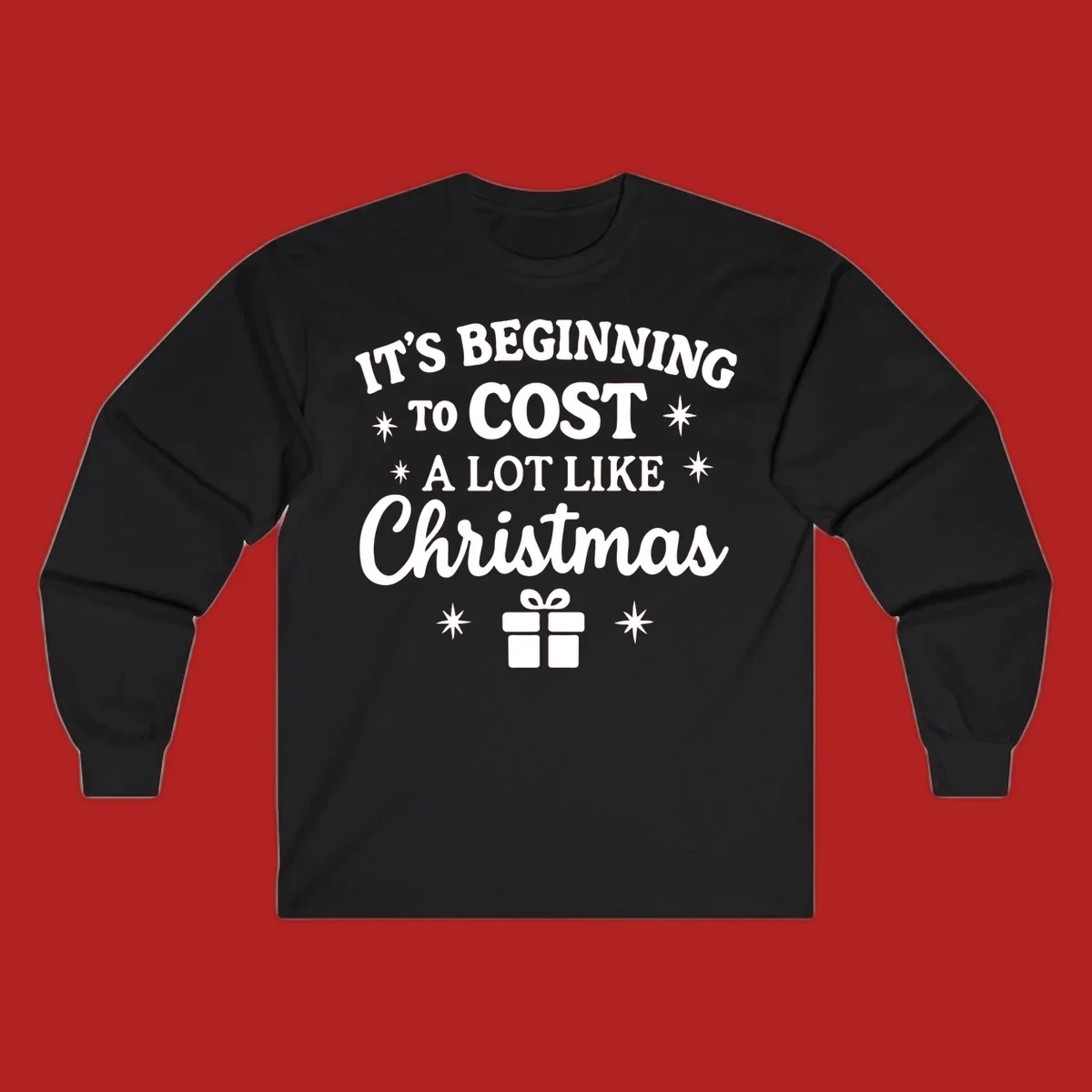 Typography design that says "It's Beginning To Cost A Lot Like Christmas" with stars and a gift box.