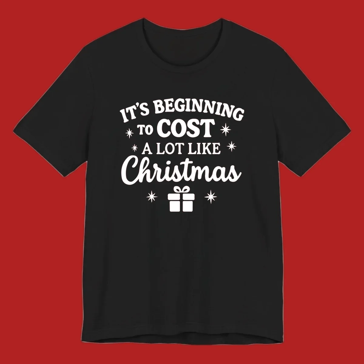 Typography design that says "It's Beginning To Cost A Lot Like Christmas" with stars and a gift box.