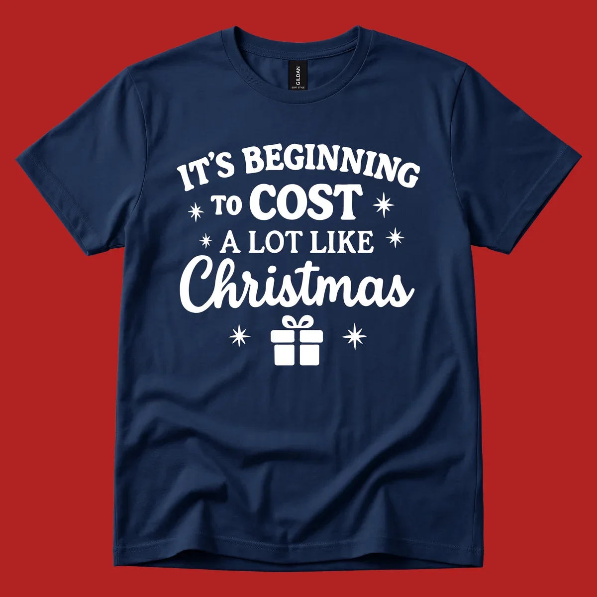 Typography design that says "It's Beginning To Cost A Lot Like Christmas" with stars and a gift box.
