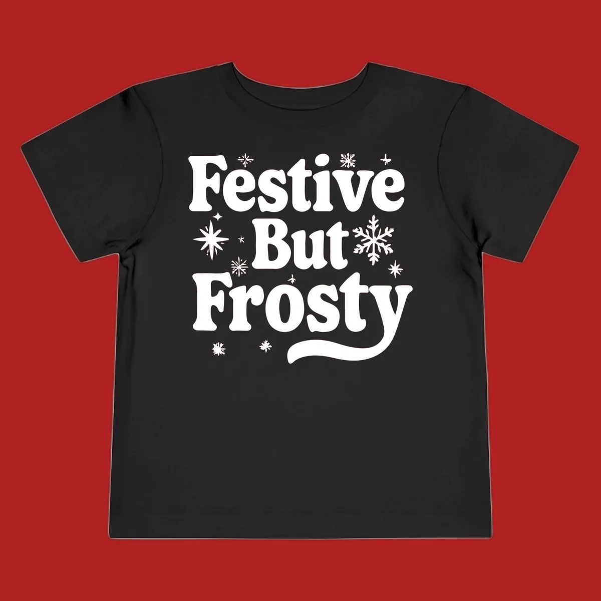 Festive But Frosty text with snowflakes and stars, holiday design.