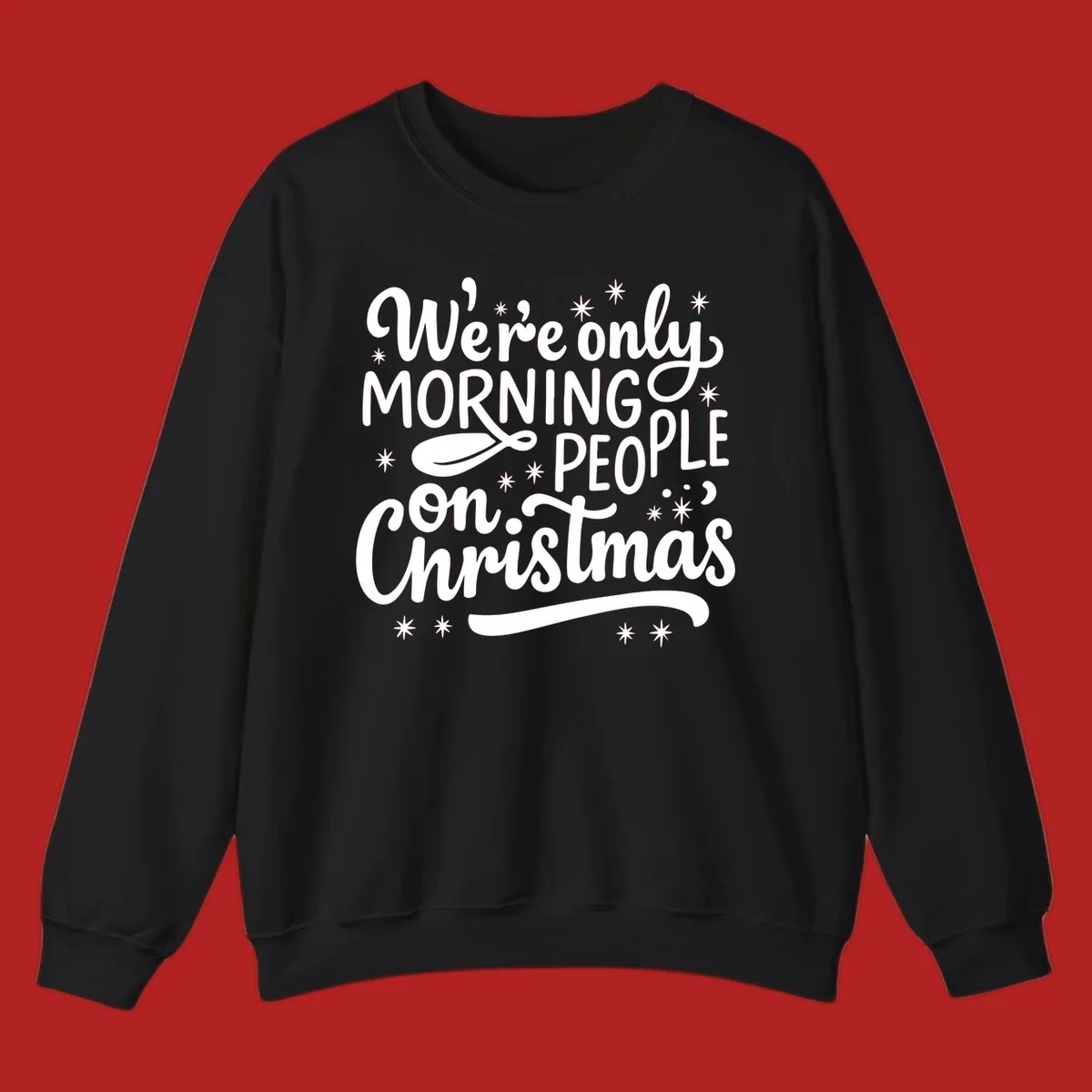 White text that says We're only MORNING PEOPLE on Christmas, with stars and a spoon.
