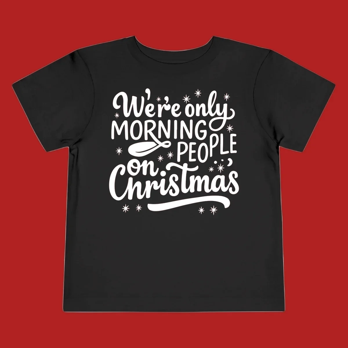 White text that says We're only MORNING PEOPLE on Christmas, with stars and a spoon.