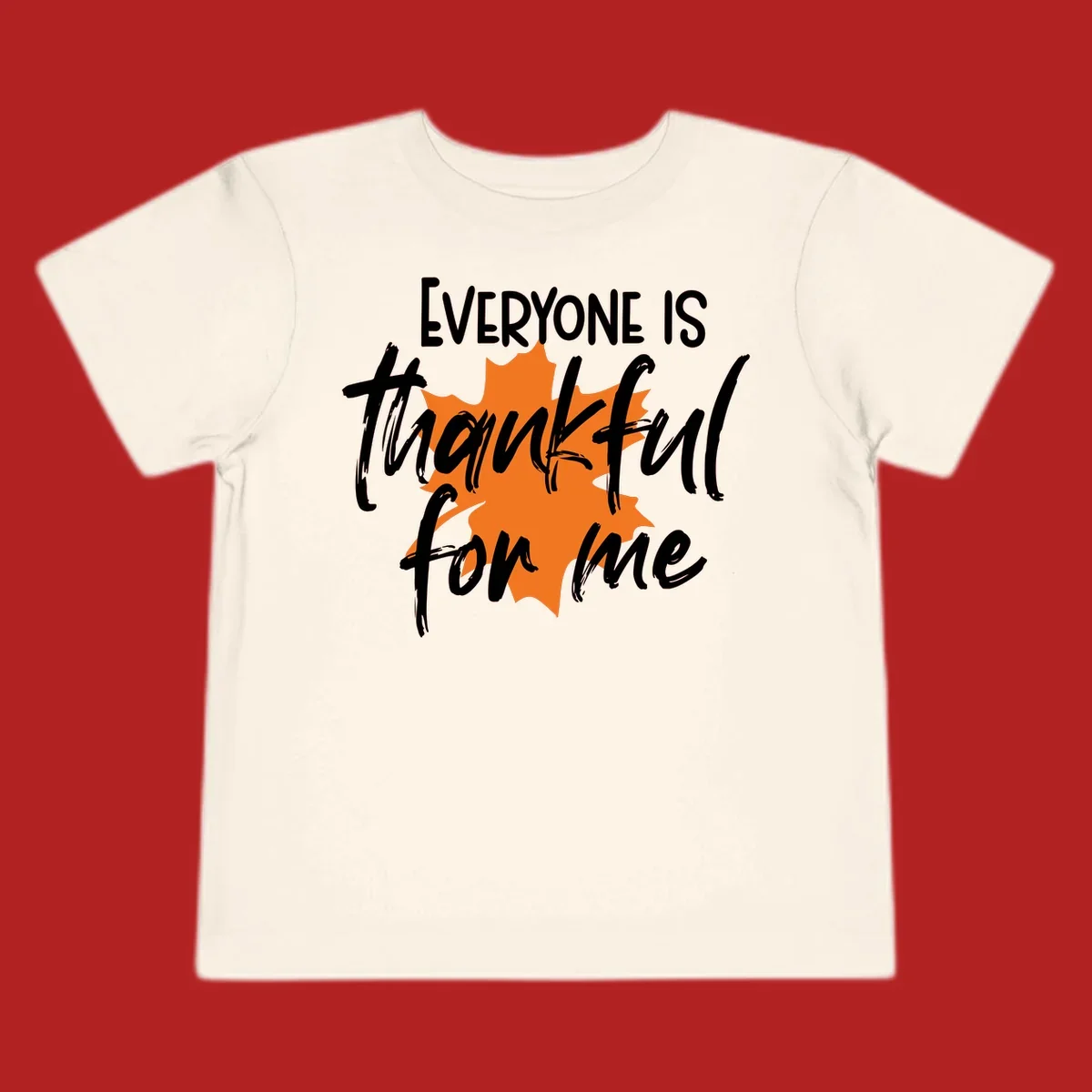 Text that reads "EVERYONE IS thankful for me" over an orange maple leaf. thankful-for-me design.
