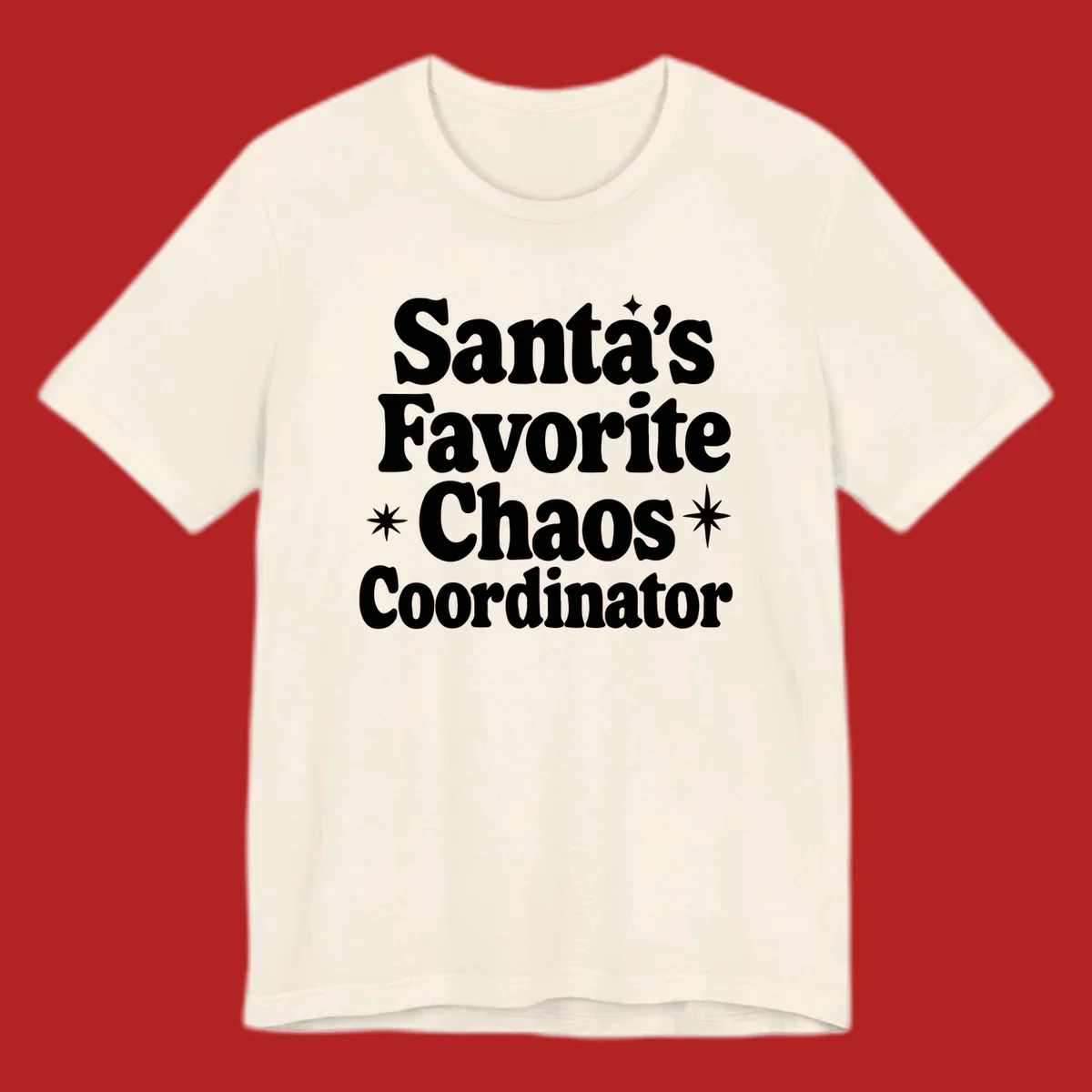 White retro typography reads 'Santa's Favorite Chaos Coordinator' with star accents.