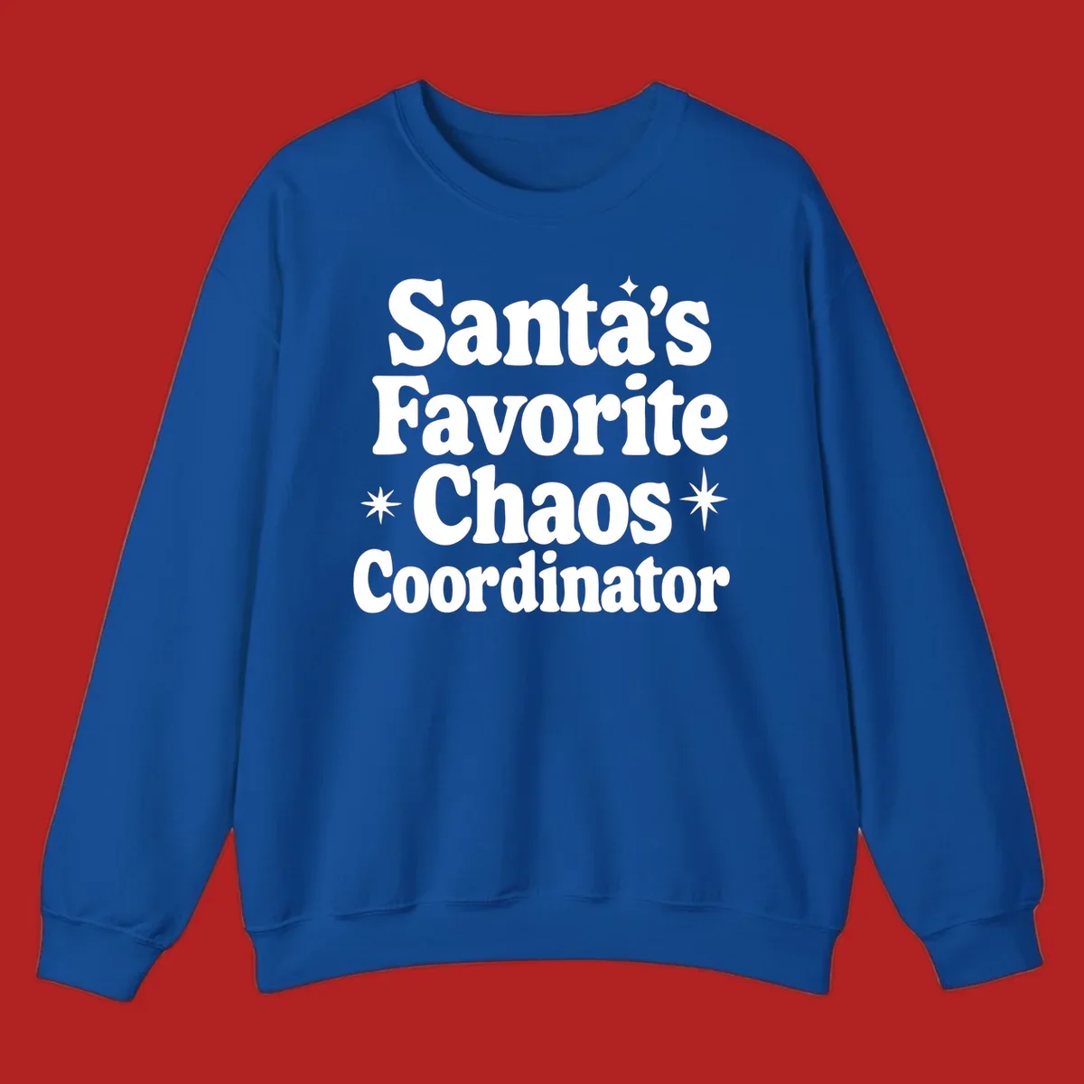 White retro typography reads 'Santa's Favorite Chaos Coordinator' with star accents.