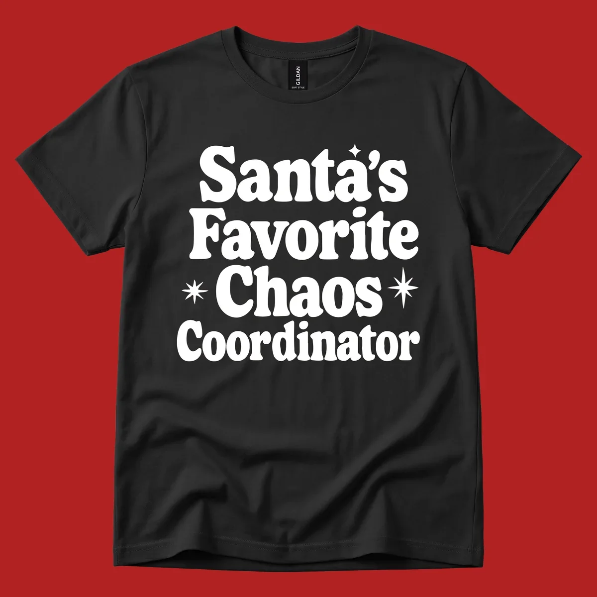 White retro typography reads 'Santa's Favorite Chaos Coordinator' with star accents.