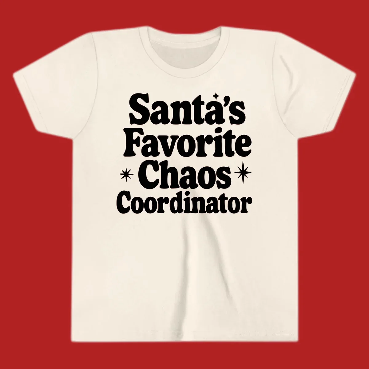White retro typography reads 'Santa's Favorite Chaos Coordinator' with star accents.