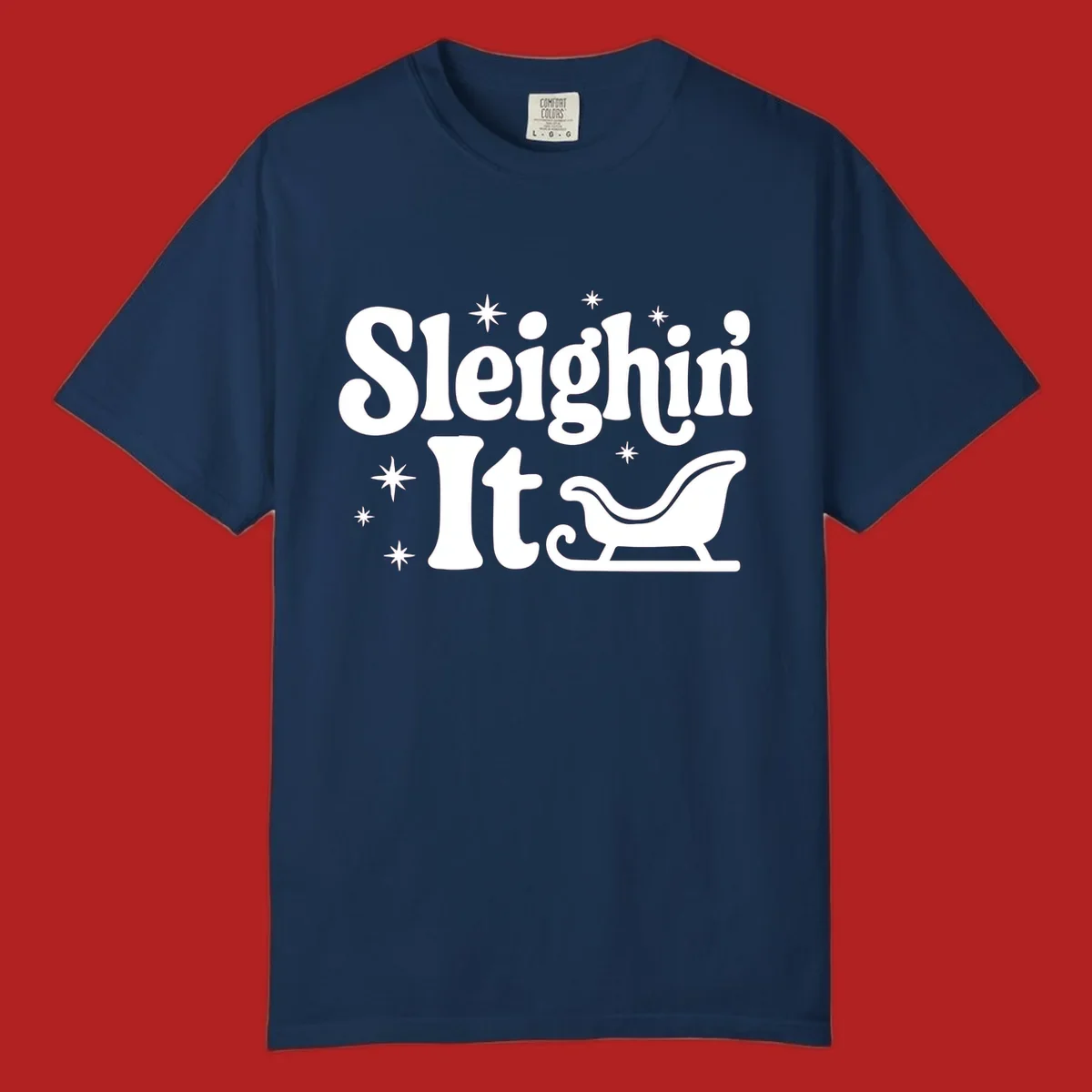 Sleighin It Christmas text and sleigh graphic.