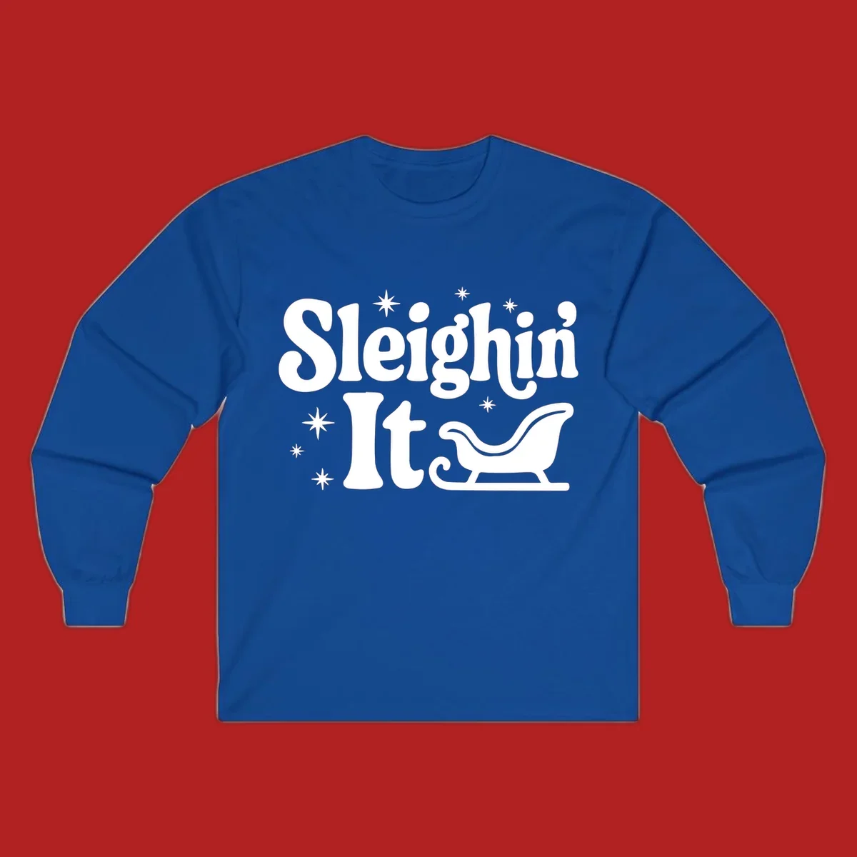 Sleighin It Christmas text and sleigh graphic.