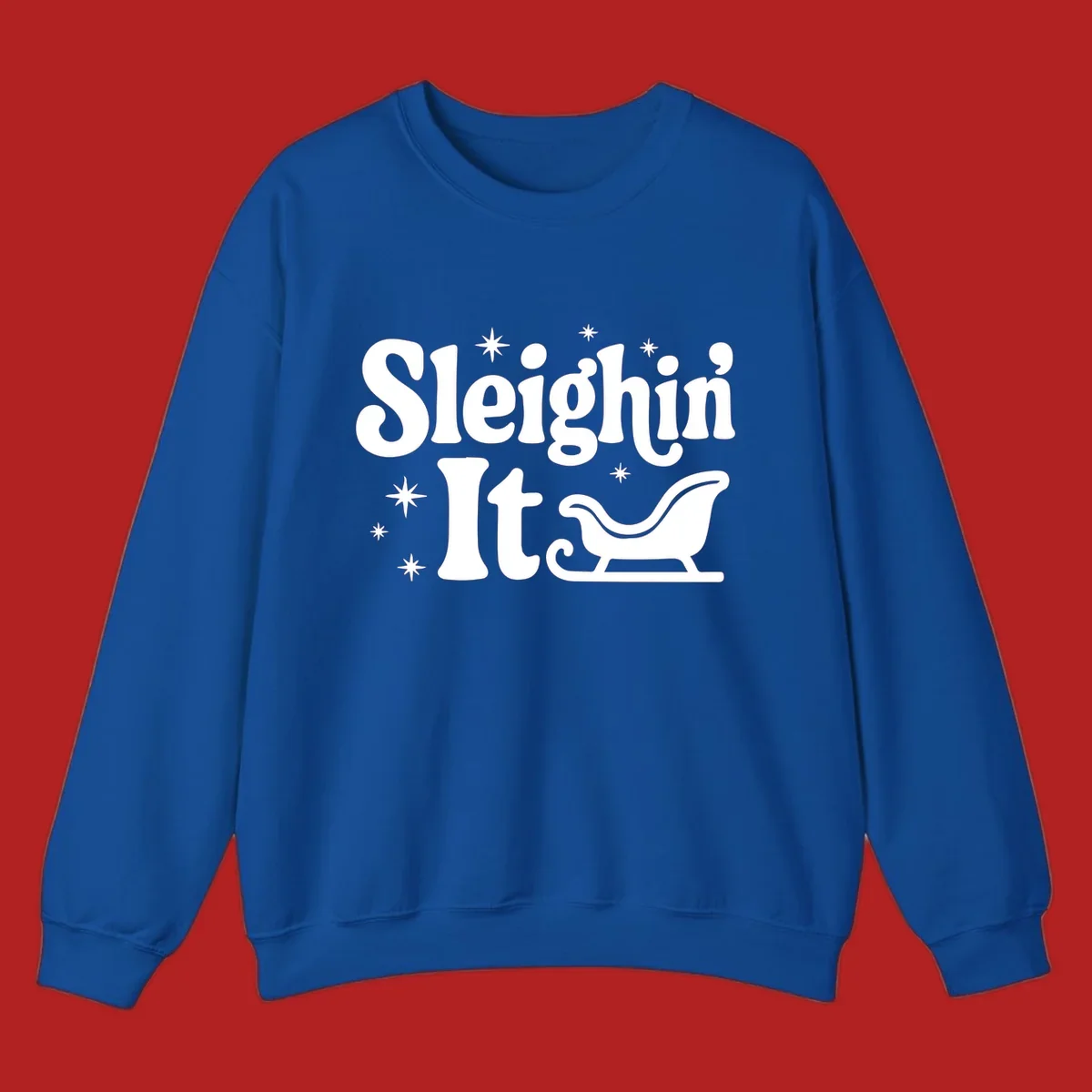 Sleighin It Christmas text and sleigh graphic.