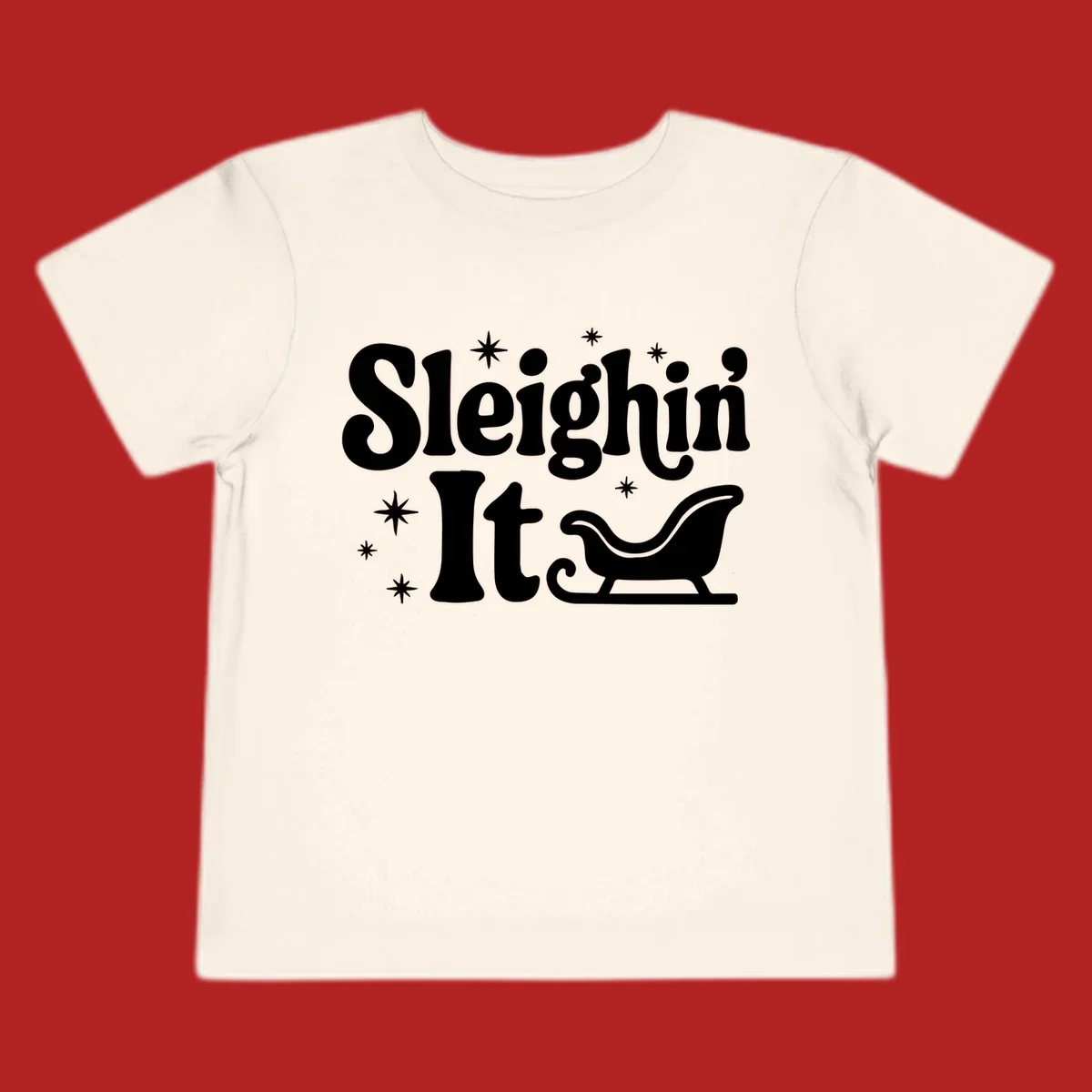 Sleighin It Christmas text and sleigh graphic.
