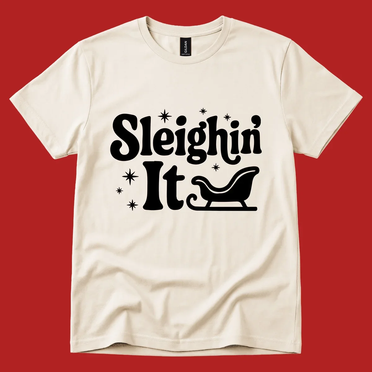 Sleighin It Christmas text and sleigh graphic.