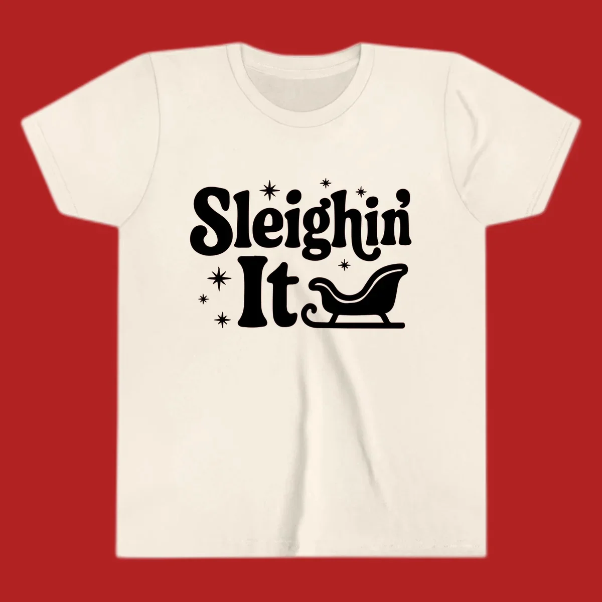 Sleighin It Christmas text and sleigh graphic.