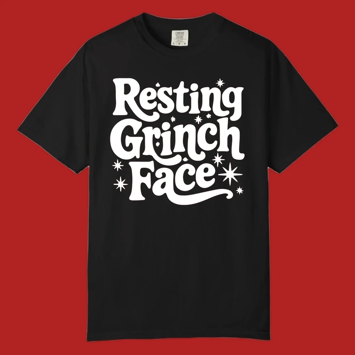 Resting Grinch Face text with stars, holiday design.