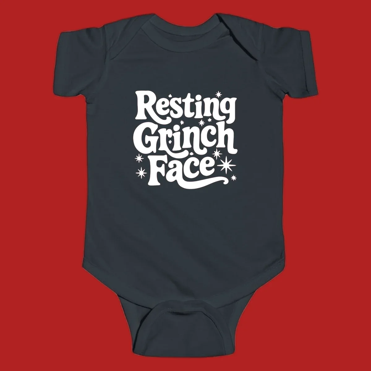 Resting Grinch Face text with stars, holiday design.